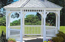 12’ Octagon No1 white vinyl gazebo with 2” x 3” turned spindles, gray rubber slate roof and gray composite flooring.