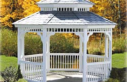 12’ Octagon Pagoda No10 white vinyl gazebo with 2” x 2” turned spindles, gray rubber roof and gray composite flooring.