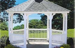 12’ Octagon Elegant No6 white vinyl 2” x 2” balusters, black architectural asphalt shingles, gray composite flooring.