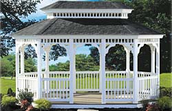 Classic oval No16 white vinyl 2” x 2” balusters, black architectural shingles, gray composite flooring.