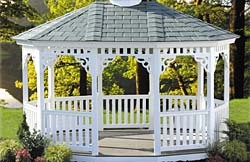 Standard Oval Pagoda No15 white vinyl 1” x 3” balusters, cedar brown rubber roof, brown composite flooring.