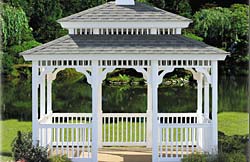 Rectangle No9 white vinyl, 2” x 2” balusters, weather wood architectural shingles, brown composite flooring.